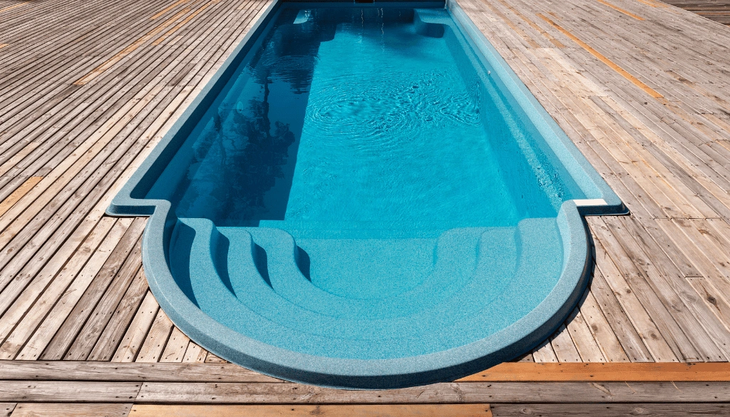 Concrete vs. Fiberglass Pools: How Brushing Needs Differ